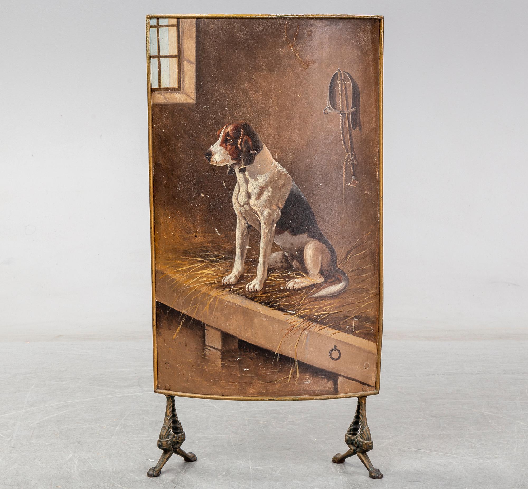 A 19th century brass fire shield decorated with paint of hunting dog setter in the stable.
