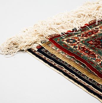 Four silk rugs/pads, probably Hereke, ca 33 x 33 cm.