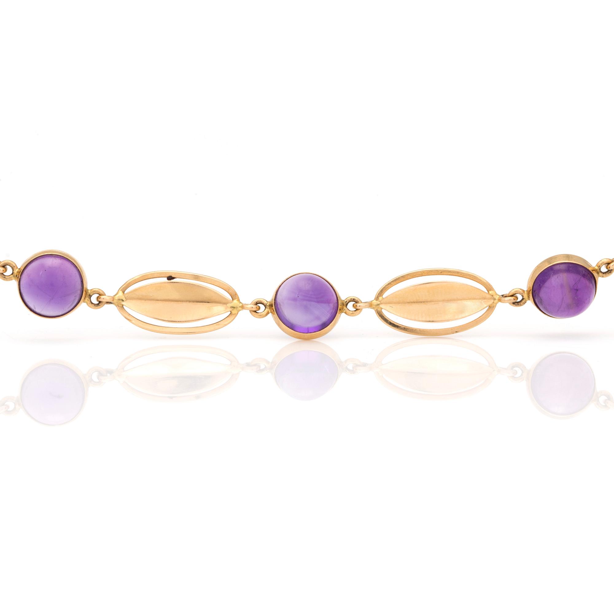 A bracelet with round, cabochon-cut amethysts.