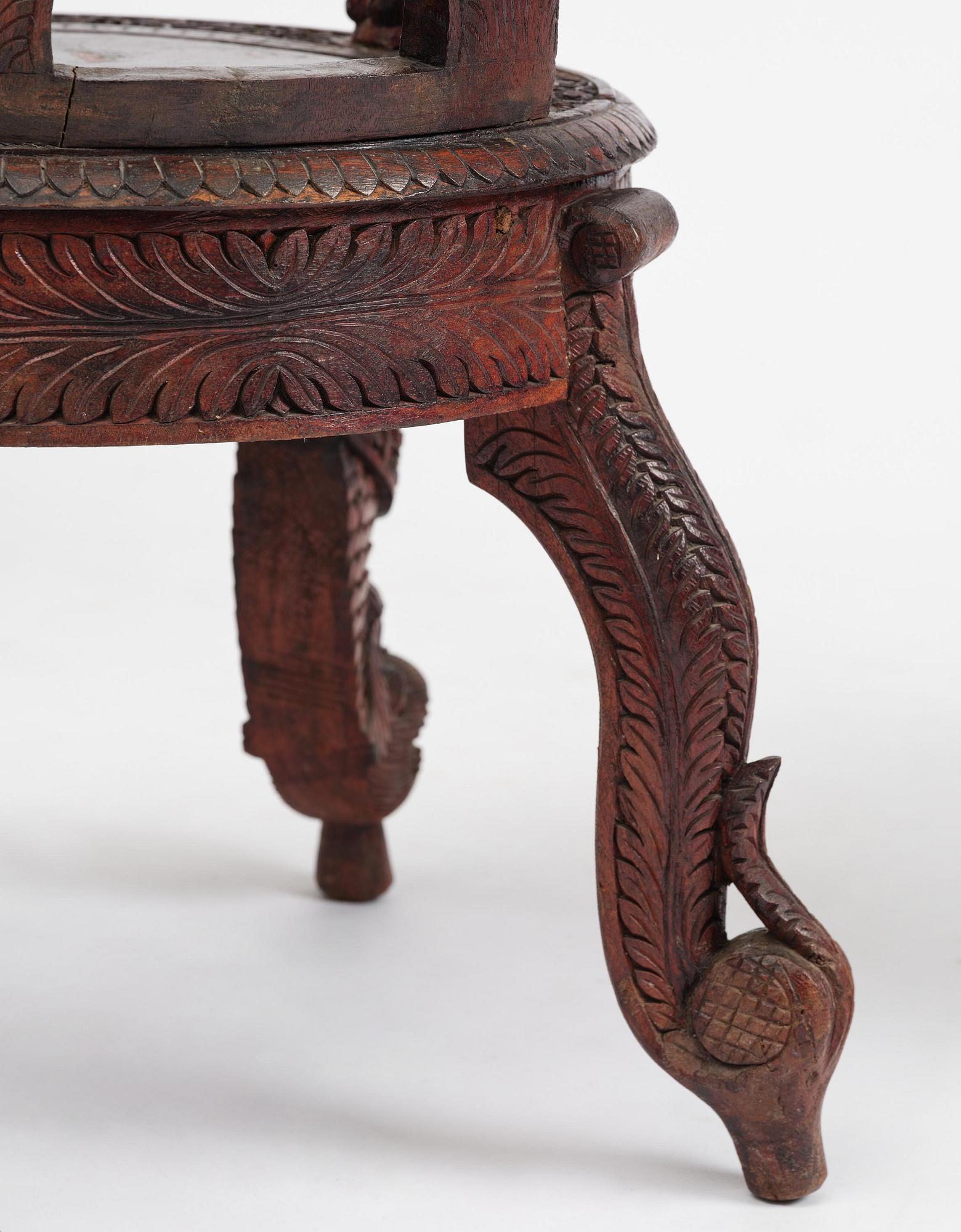 A pair of carved 'blackwood' armchairs, Bombay presidency, British Raj, circa 1880.