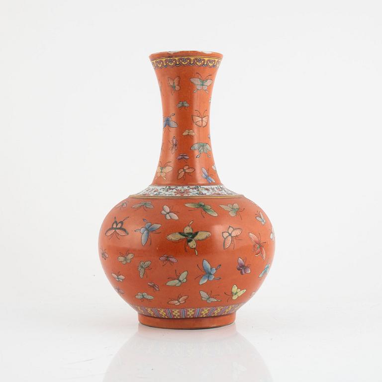 A Chinese coral read ground butterfly vase, 20th century.