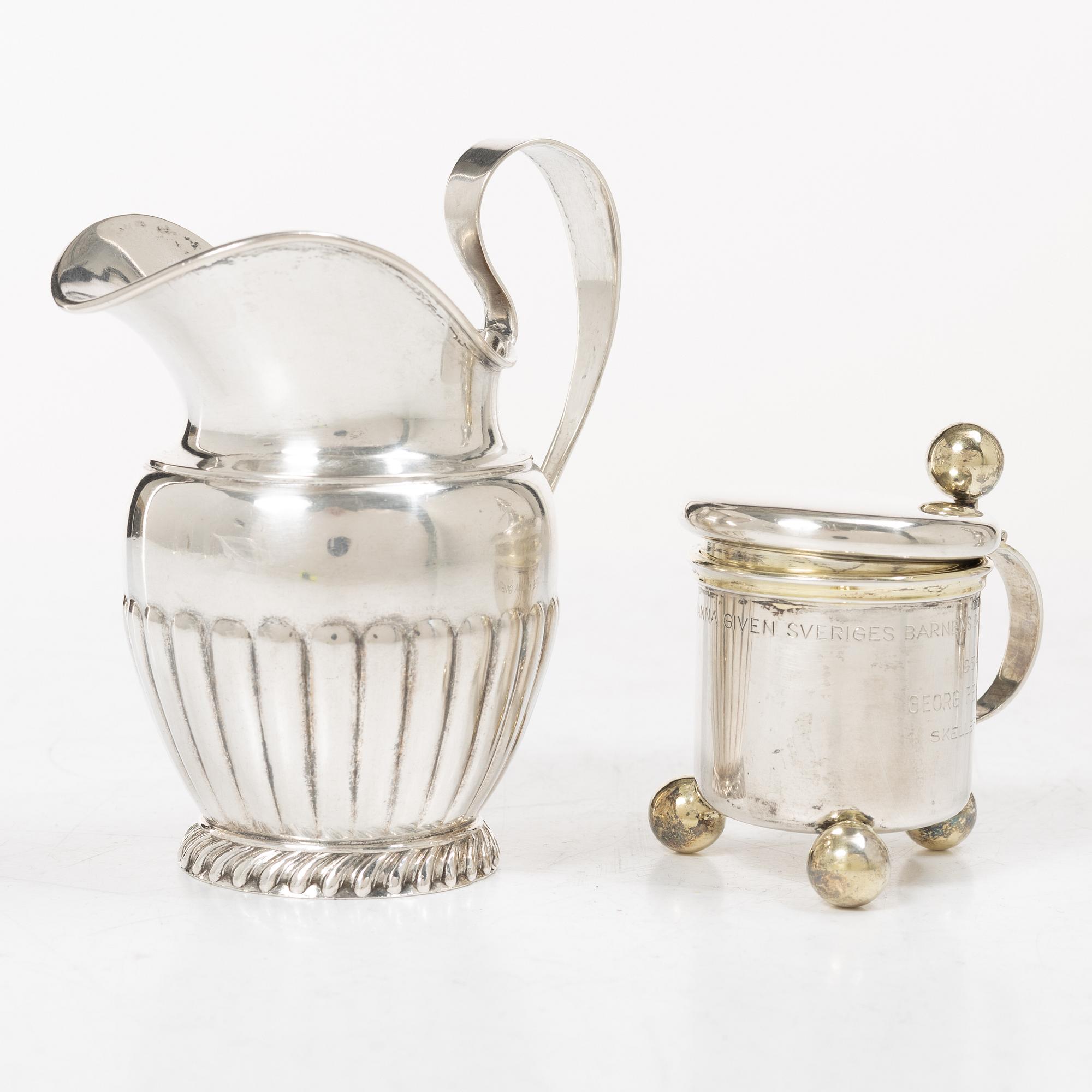 Sugar tongs, cream jug and miniature decanter, silver, including CG Hallberg, Stockholm 1955.