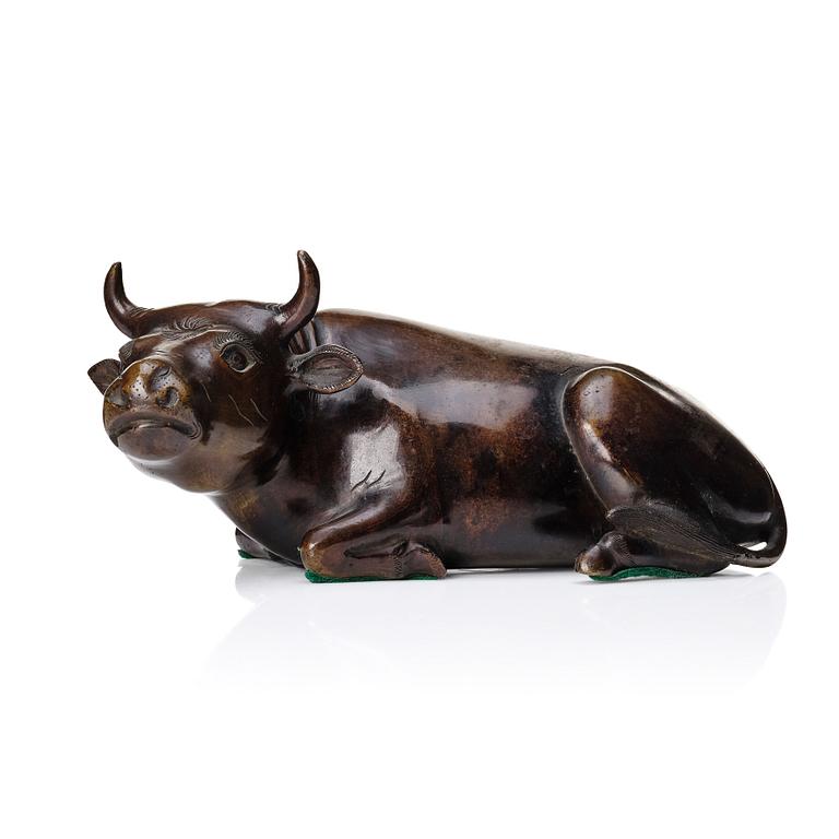 A bronze sculpture of a reclining buffalo, Qing dynasty, 19th Century.