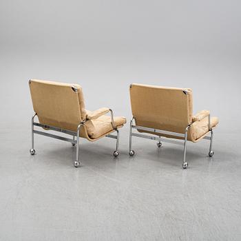 Bruno Mathsson, a pair of easy chairs and a coffee table, 'Karin', Dux, second half of the 20th Century.