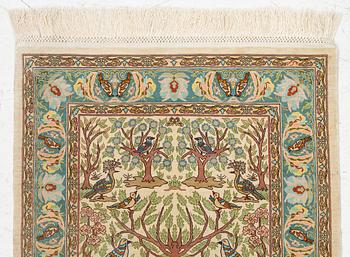 A figural silk Hereke rug, c 65 x 47 cm.