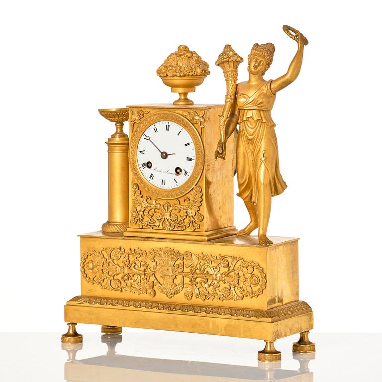 An Empire ormolu figural mantel clock, early 19th century.