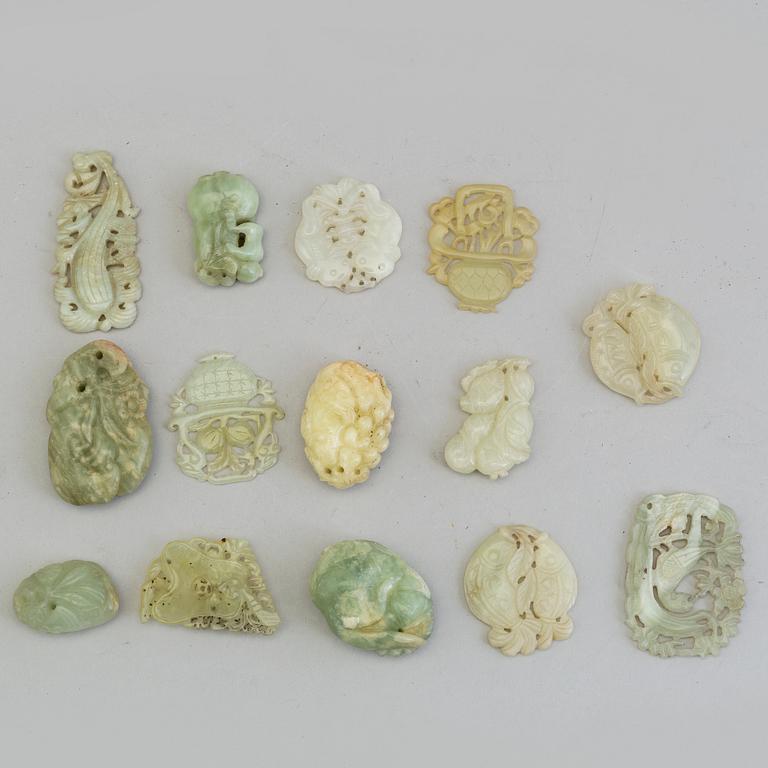 A set of 14 Chinese pendants/charms, some nephrite.