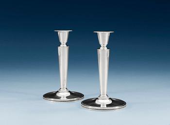 953. A PAIR OF ERIC RÅSTRÖM silver candlesticks, Stoxkholm 1967.