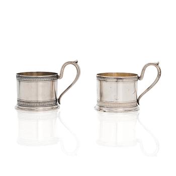 K. Fabergé, a pair of parcel-gilt silver teaglass holders, Imperial Warrant mark, Moscow 1908-17.