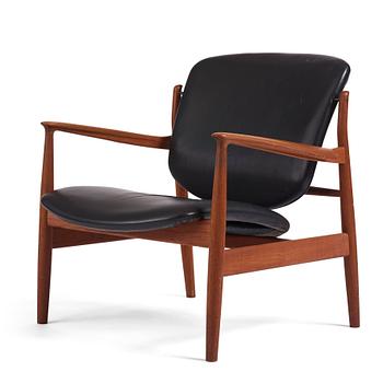 Finn Juhl, a teak and black leather 'model 136' easy chair, France & Daverkosen, Denmark 1950-60s.