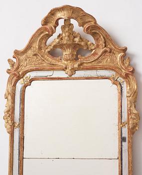 A Swedish giltwood and carved rococo mirror, later part of the 18th century.