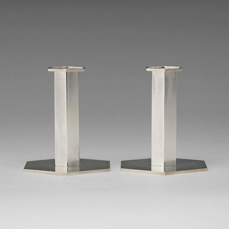 Wiwen Nilsson, a pair of sterling candlesticks, Lund 1964 and 1968.