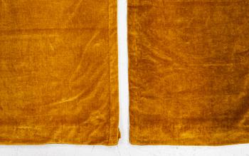 A set of four yellow velvet curtains, 1910's/20's, ca 247 x 120 cm.