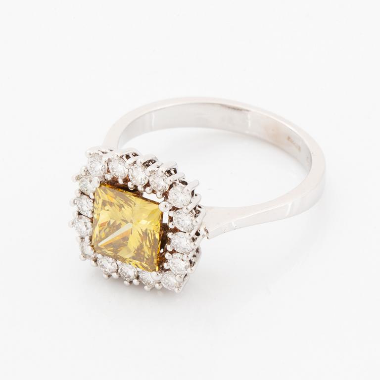 Princess-cut colour treated fancy deep brown-yellow diamond ring.