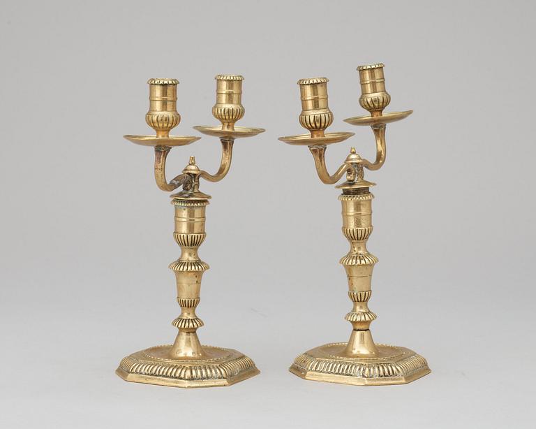 A pair of Swedish Baroque early 18th century bronze two-light candelabra.