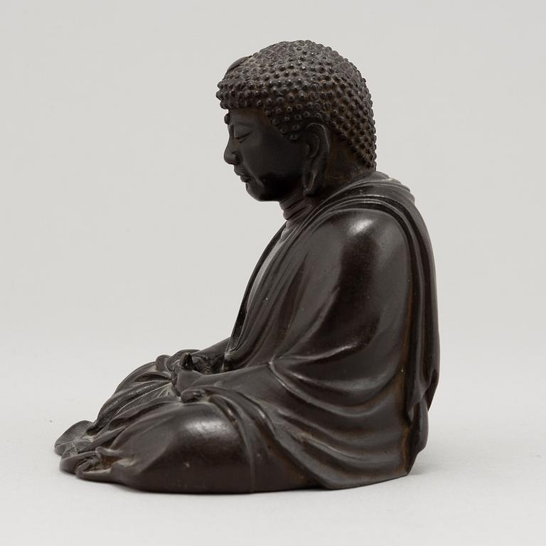 A Japanese seated bronze okimono of Amitabha buddha, 20th century.