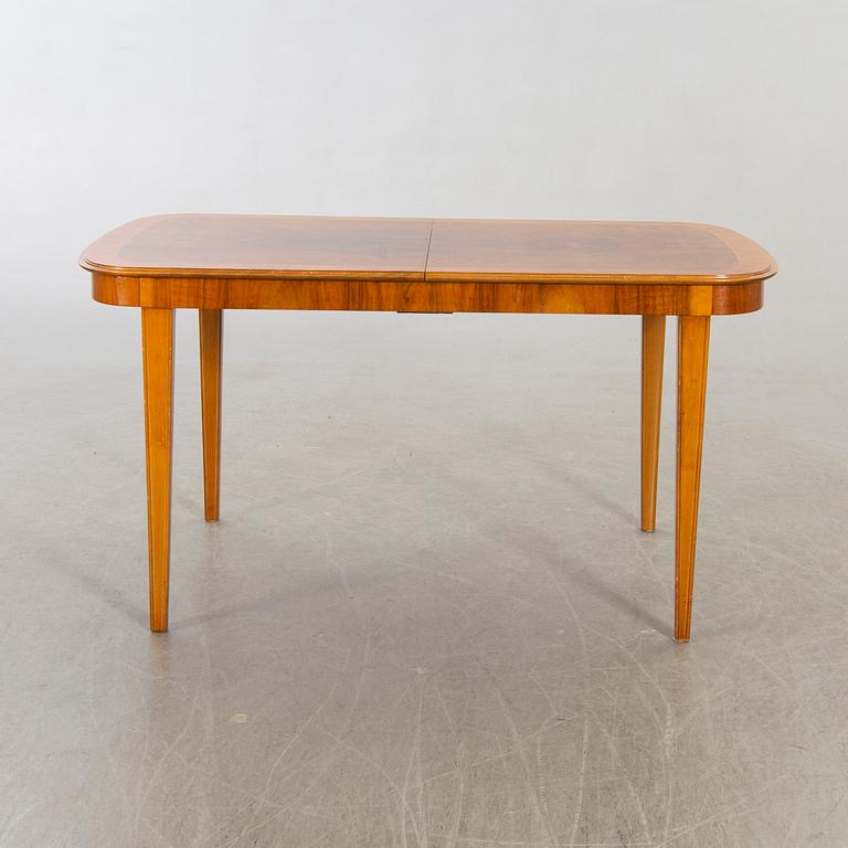 A 1950/60's dining table and chairs.