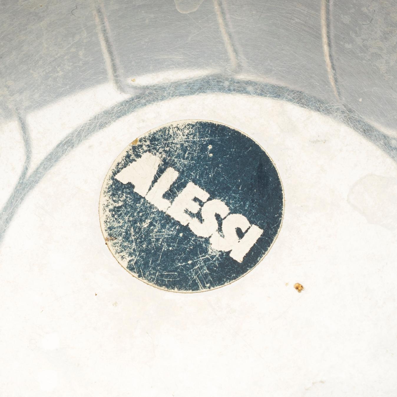 2 pieces of Alessi stainless steel table ware.