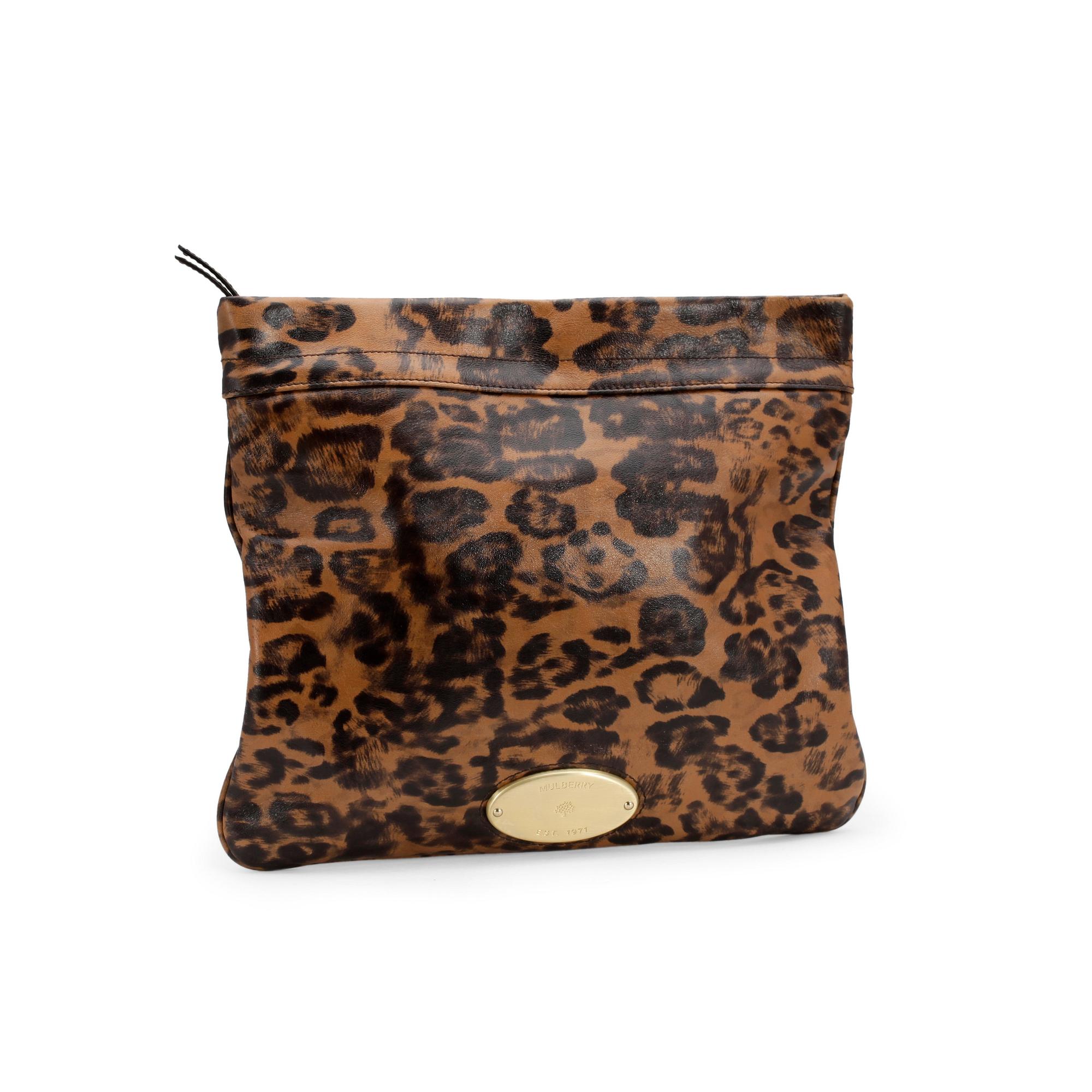 MULBERRY, a leopard printed leather clutch with gold colored hardwear.