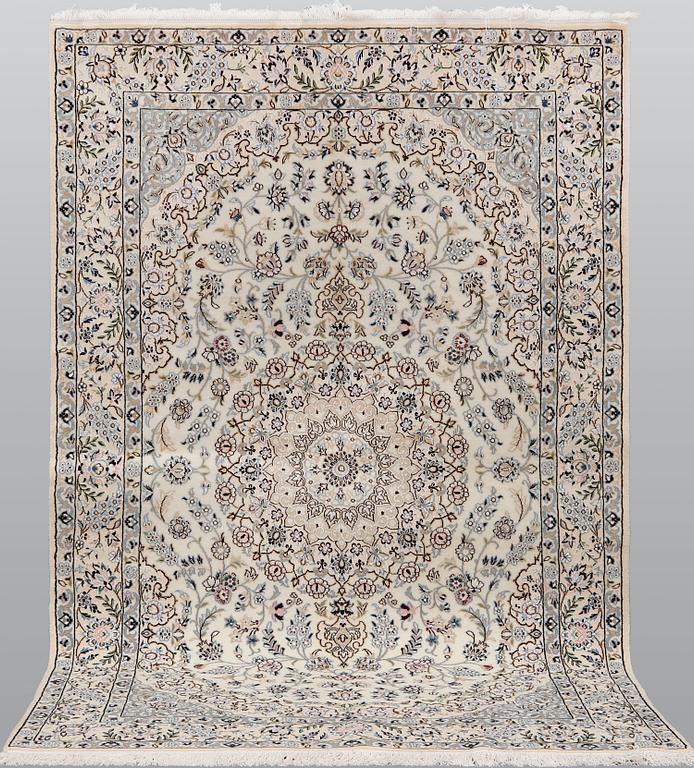 A Nain part silk carpet, 254 x 156 cm.
