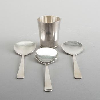 A Swedish 20th century sterling set of three sandwich spoons ad a beaker mark of W Nilsson Lund 1965, 1967 and 1946,