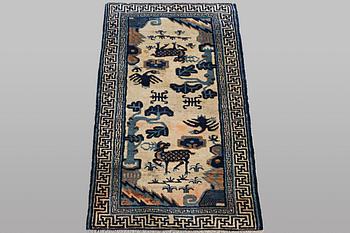 A rug, antique China, ca 125 x 60 cm.