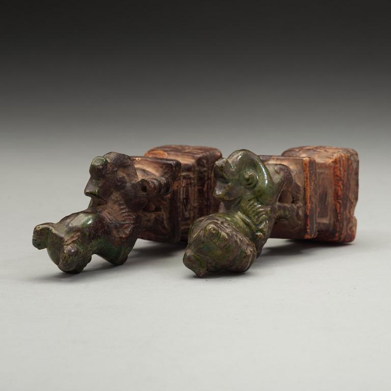 A pair of green and yellow glazed joss stick holders, Ming dynasty (1368-1644).