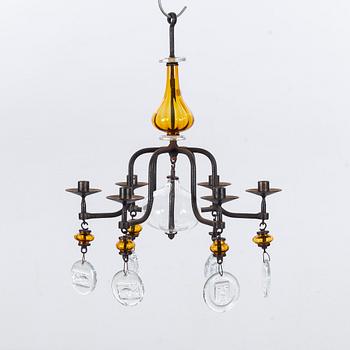 ERIK HÖGLUND,A pair of wall candle holders and a chandelier, kosta Boda, second half of the 20th century.