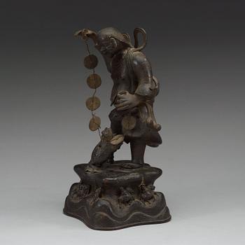 A bronze figure of Liu Hai with money and a three legged toad, Qing dynasty (1644-1912).