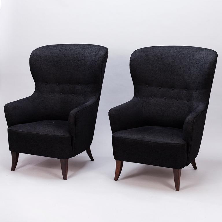 A pair of mid-20th century armchairs.