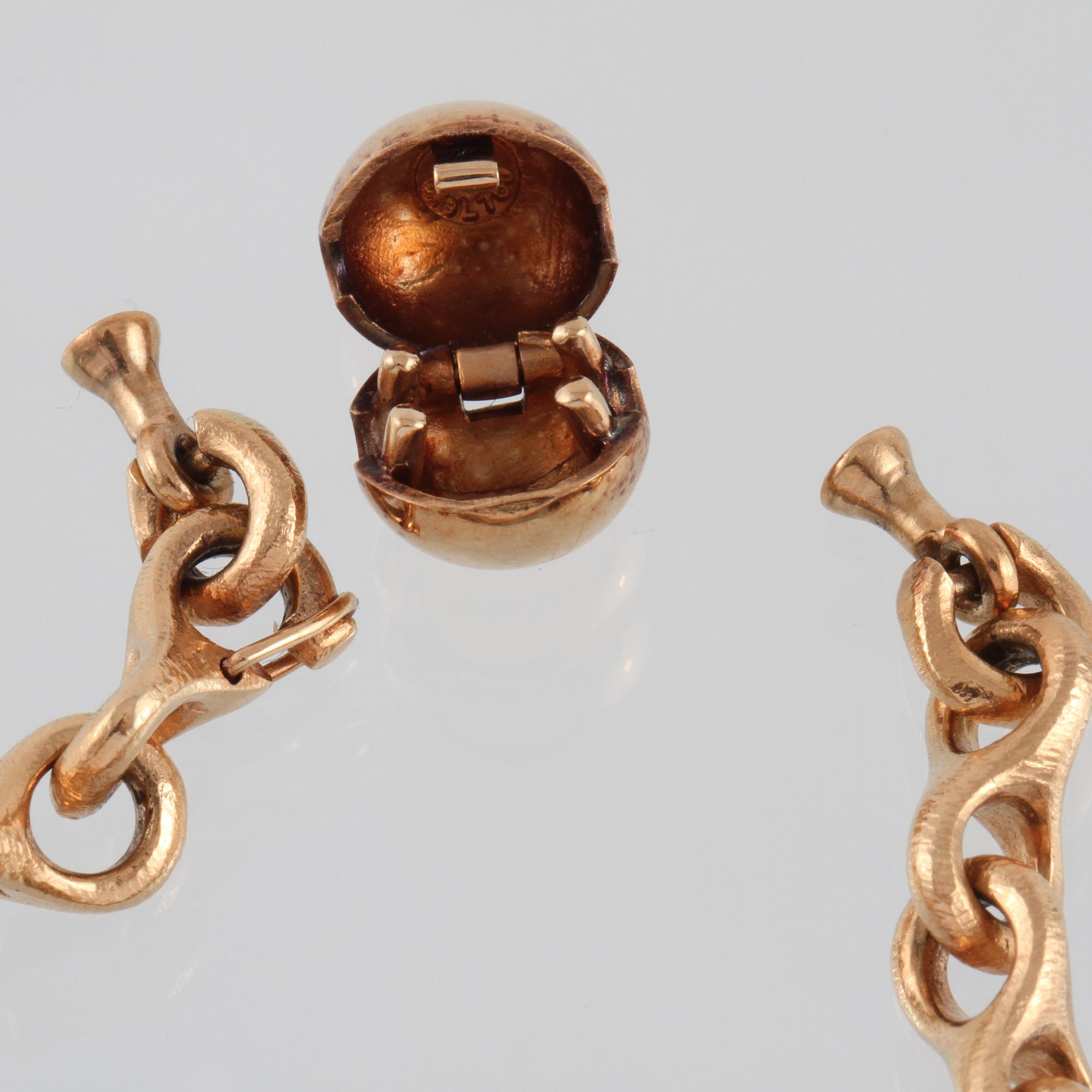 ARMBAND, 18K guld, en berlock med briljantslipad diamant, Ole Lynggaard.
