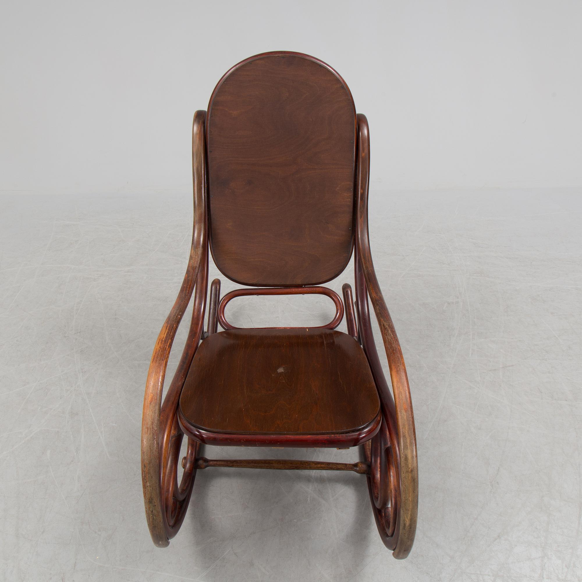 A stained rocking chair by Thonet, about 1900.