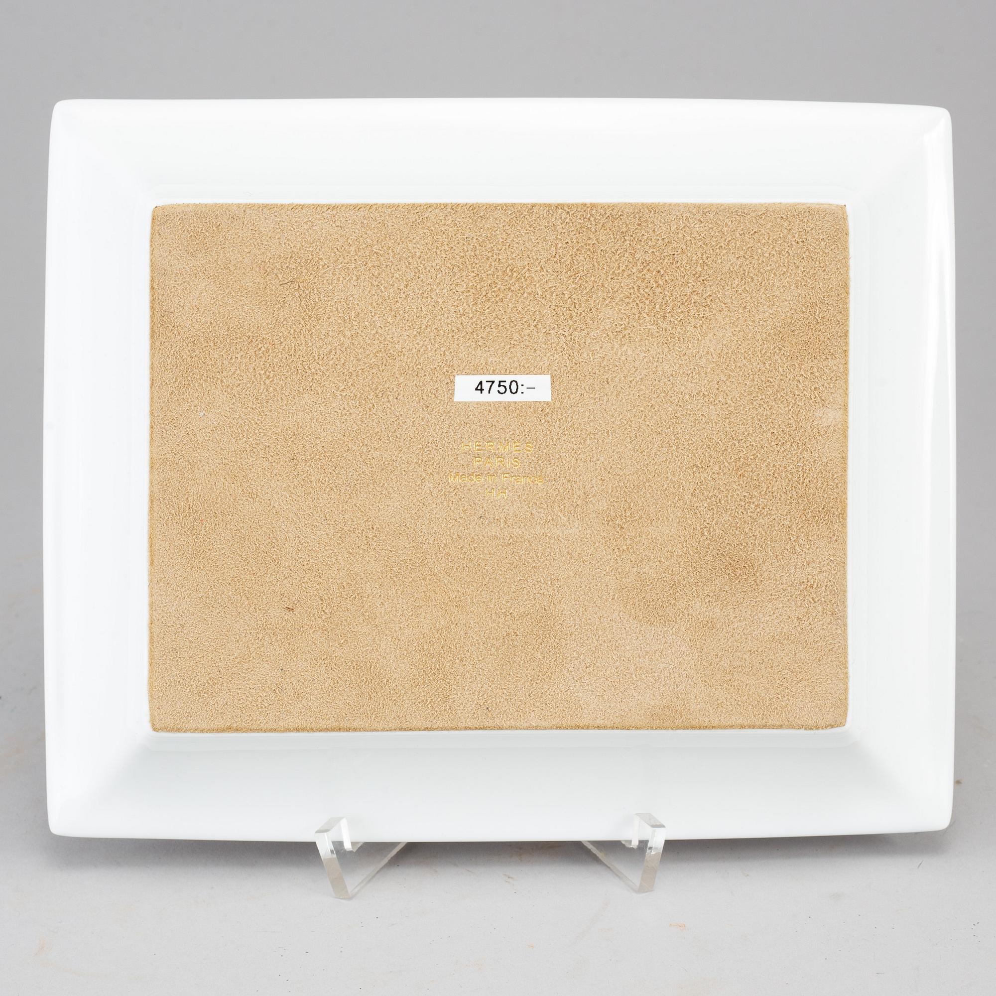 HERMÈS, a porcelain change tray.