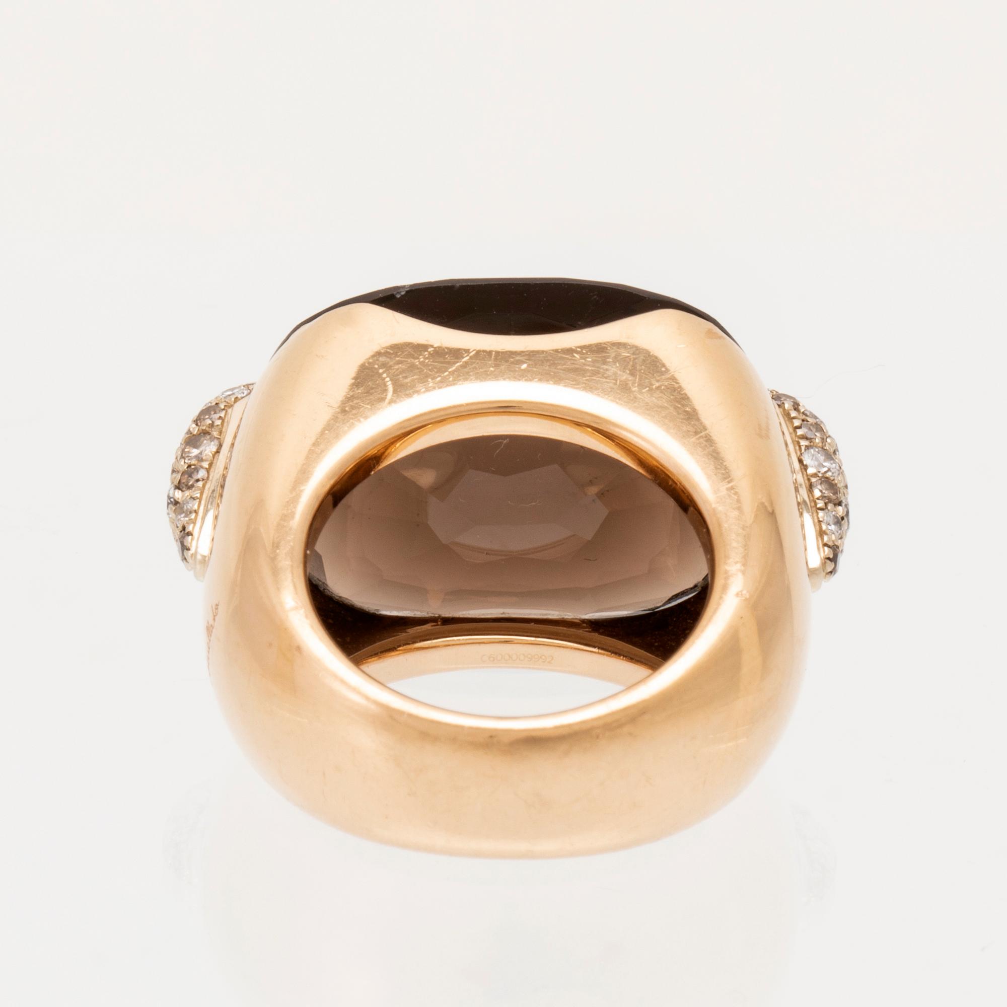 An 18K gold Pomellato "Pin Up" ring set with smoky quartz and round brilliant-cut diamonds.