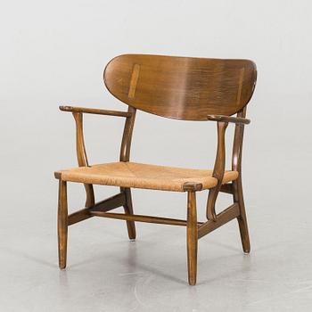 HANS J WEGNER, a "CH-22" armchair, Carl Hansen & Son, Denmark.