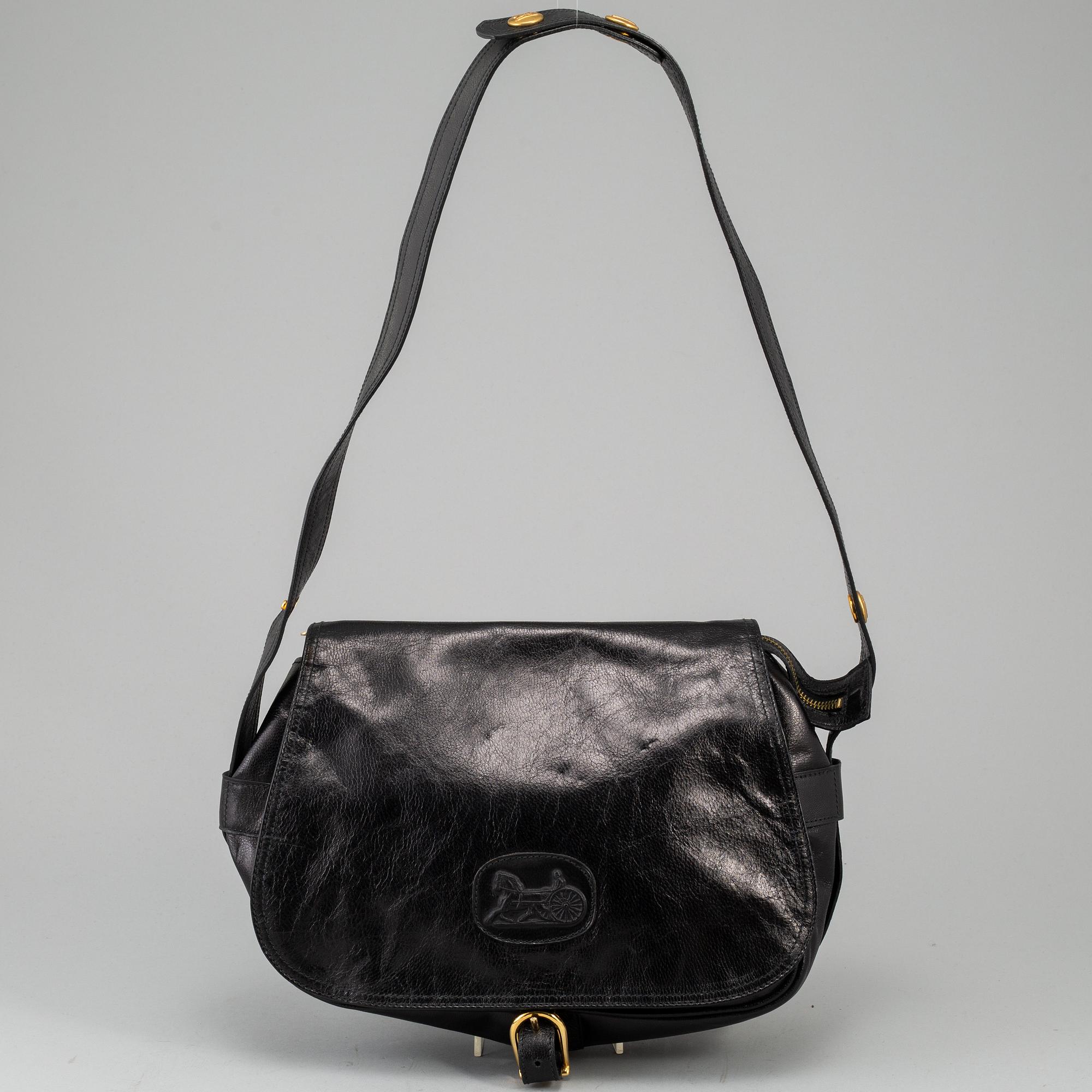 CÉLINE,a black leather handbag.
