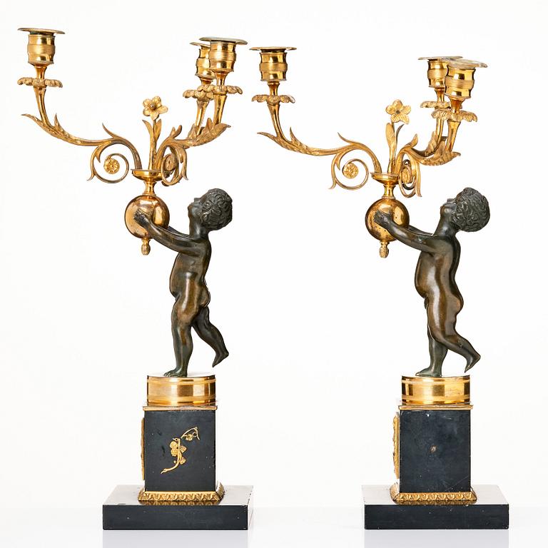 A pair of late Gustavian candelabra.