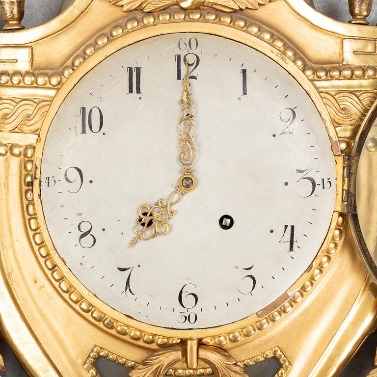 A Gustavian pendulum wall clock.