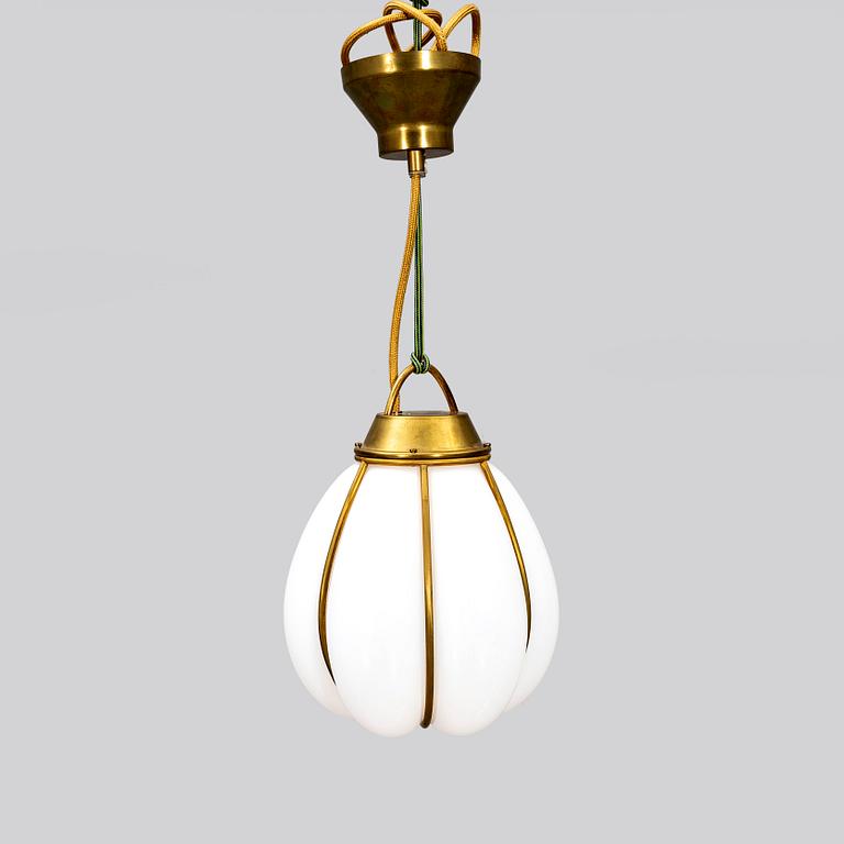 A contemporary 'Hobo' brass and glass pendant lamp by Gustaf Nordenskiöld for Örsjö.