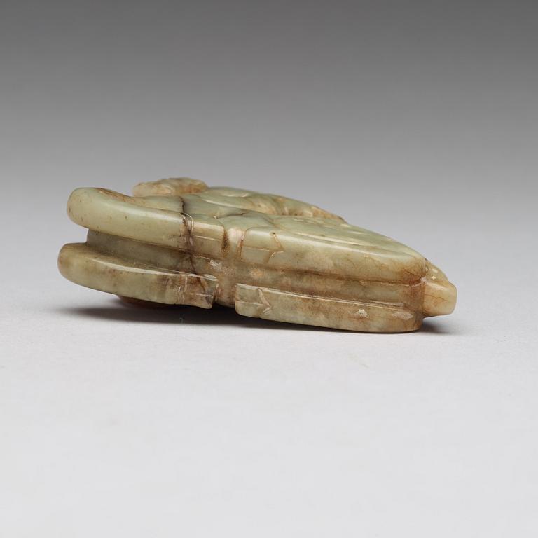 A carved nephrite figure of a reclining deer, late Qing dynasty.