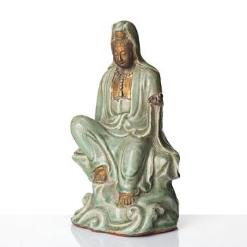 A seated celadon figure of Guanyin, presumably Longquan Ming dynasty, 17th Century.