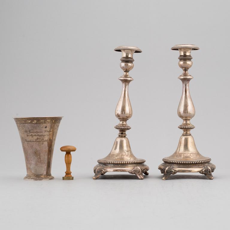 Four items with a royal provenance. Silver candlesticks, silver beaker, brass seal and a telegram.