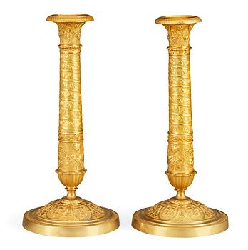 A pair of French Empire early 19th century candlesticks.