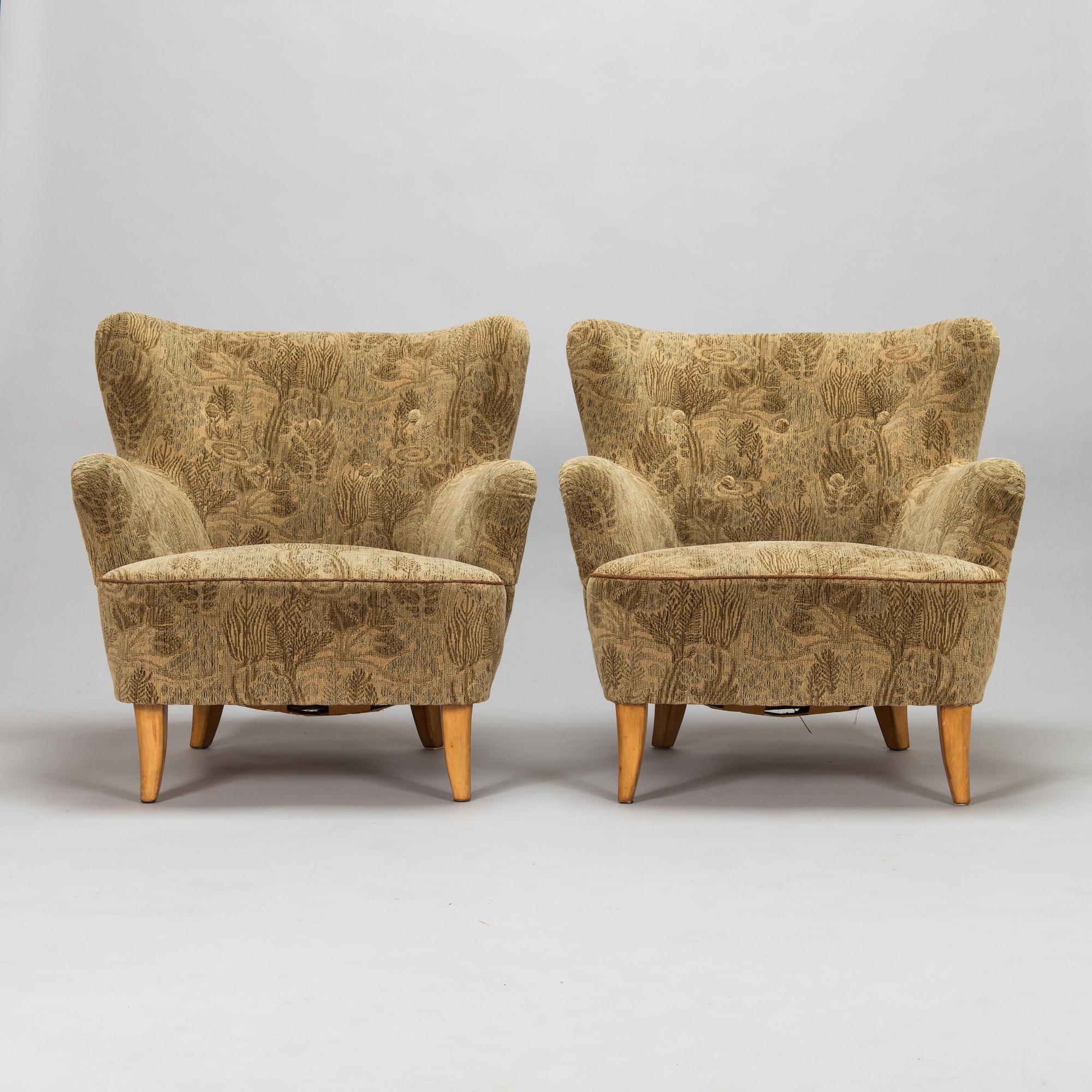 A pair of 1950s armchairs.
