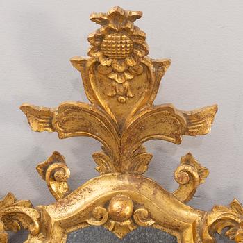 A pair of mid 20th century wood mirrors in Louis XV-style from Paoletti, Firenze Italy.