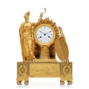 110. A French Empire 19th century gilt bronze mantel clock by Rieussec.