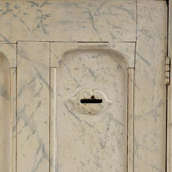 A Swedish column-shaped cabinet 19 th century.