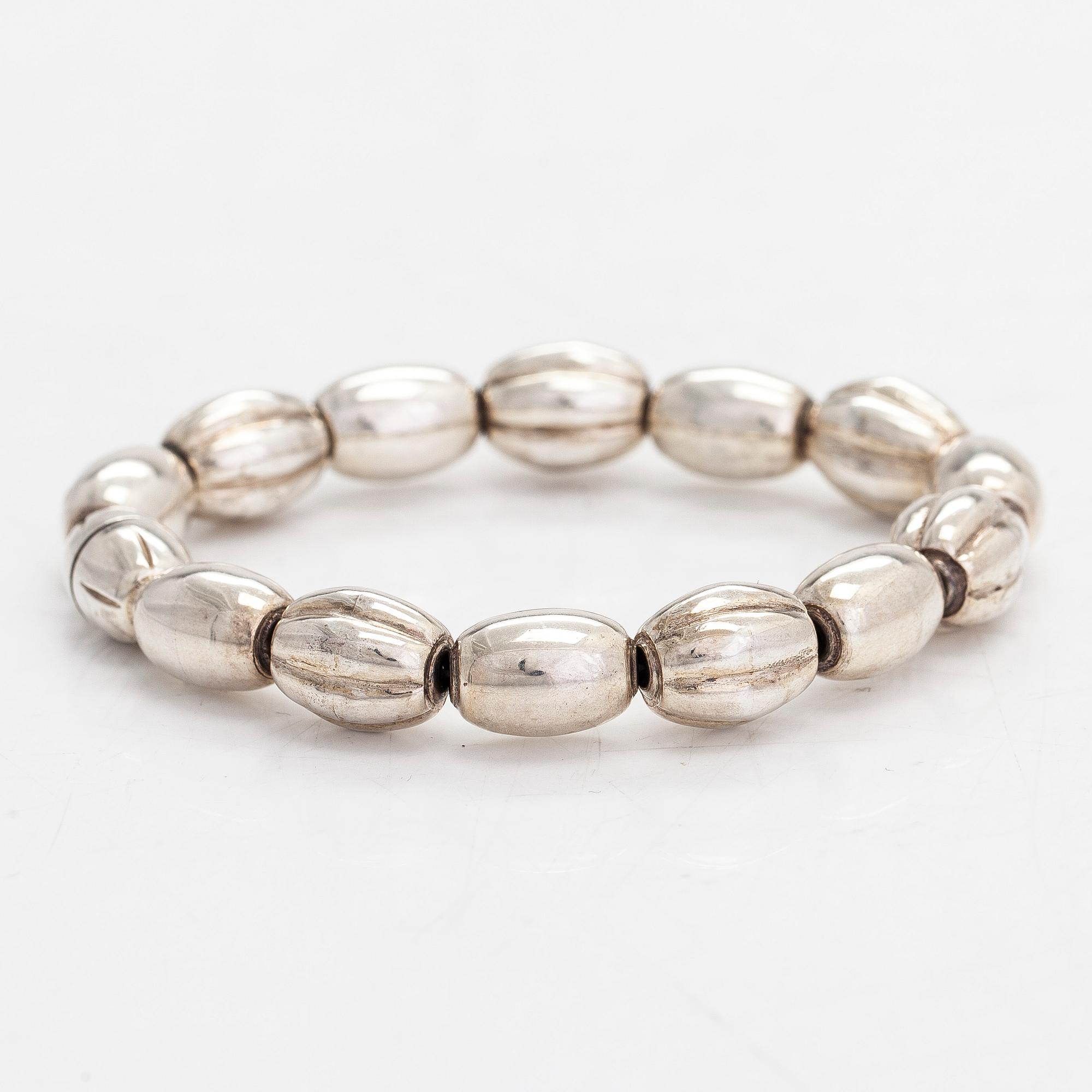 A set of silver "Halikko treasure" necklace, bracelet, ring and earrings. Kalevala Koru, Helsinki 1965-1972.