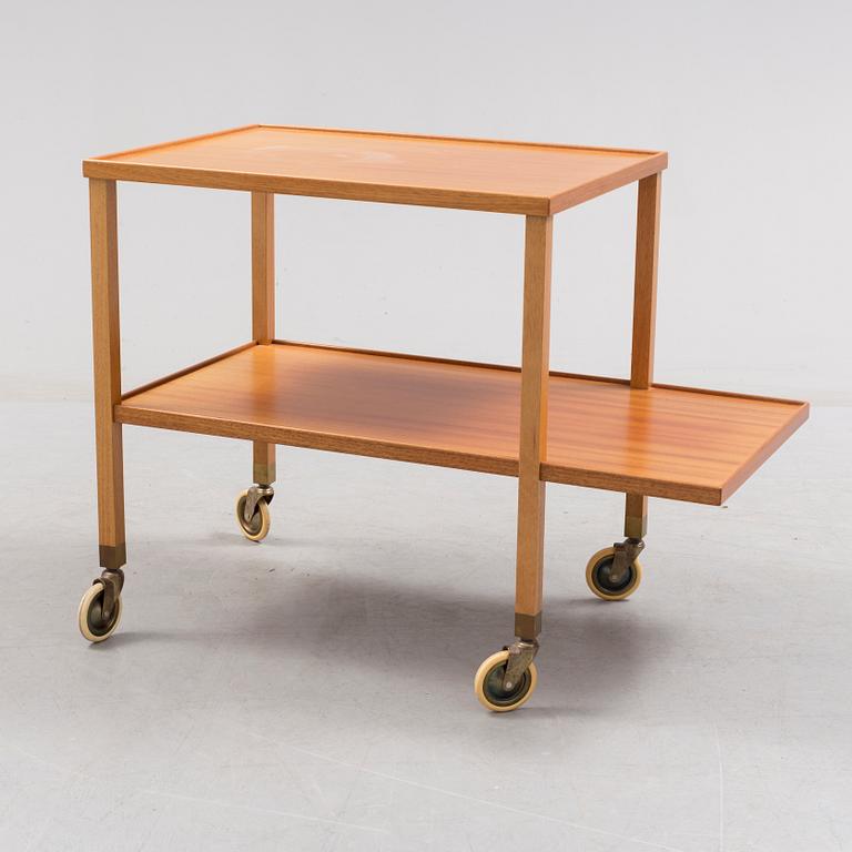 A mahogany veneer tea trolley designed in 1932 by Josef Frank for Firma Svenskt Tenn.