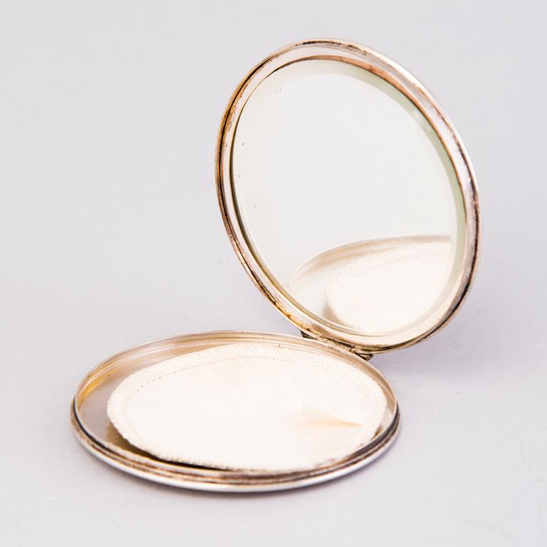 Two silver evening bags and a silver mirror, 1920s-1940s.